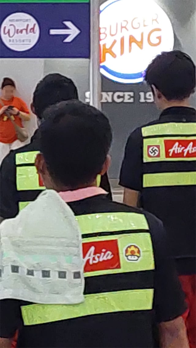 AirAsia employee uniform with swastika patch