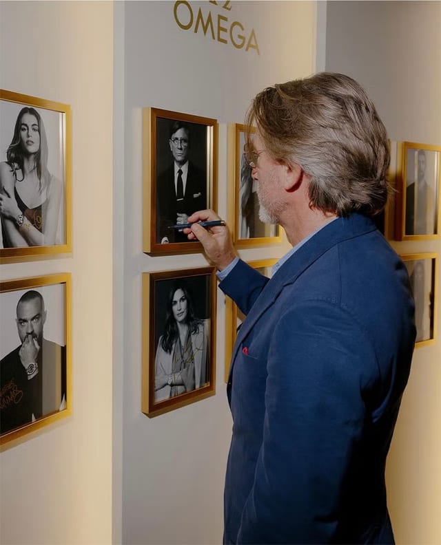 Daniel Craig signs James Bond poster