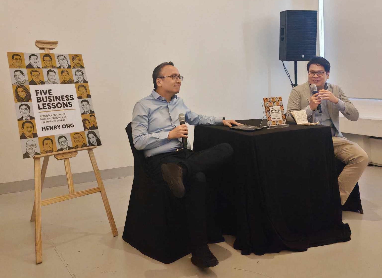 Henry Ong with Summit Books' Editor-in-Chief, Lio Mangubat, at the launch and book signing of 'Five Business Lessons: Principles on Success From the Philippines’ Top Business Leaders,' held at Fully Booked in Bonifacio Global City.