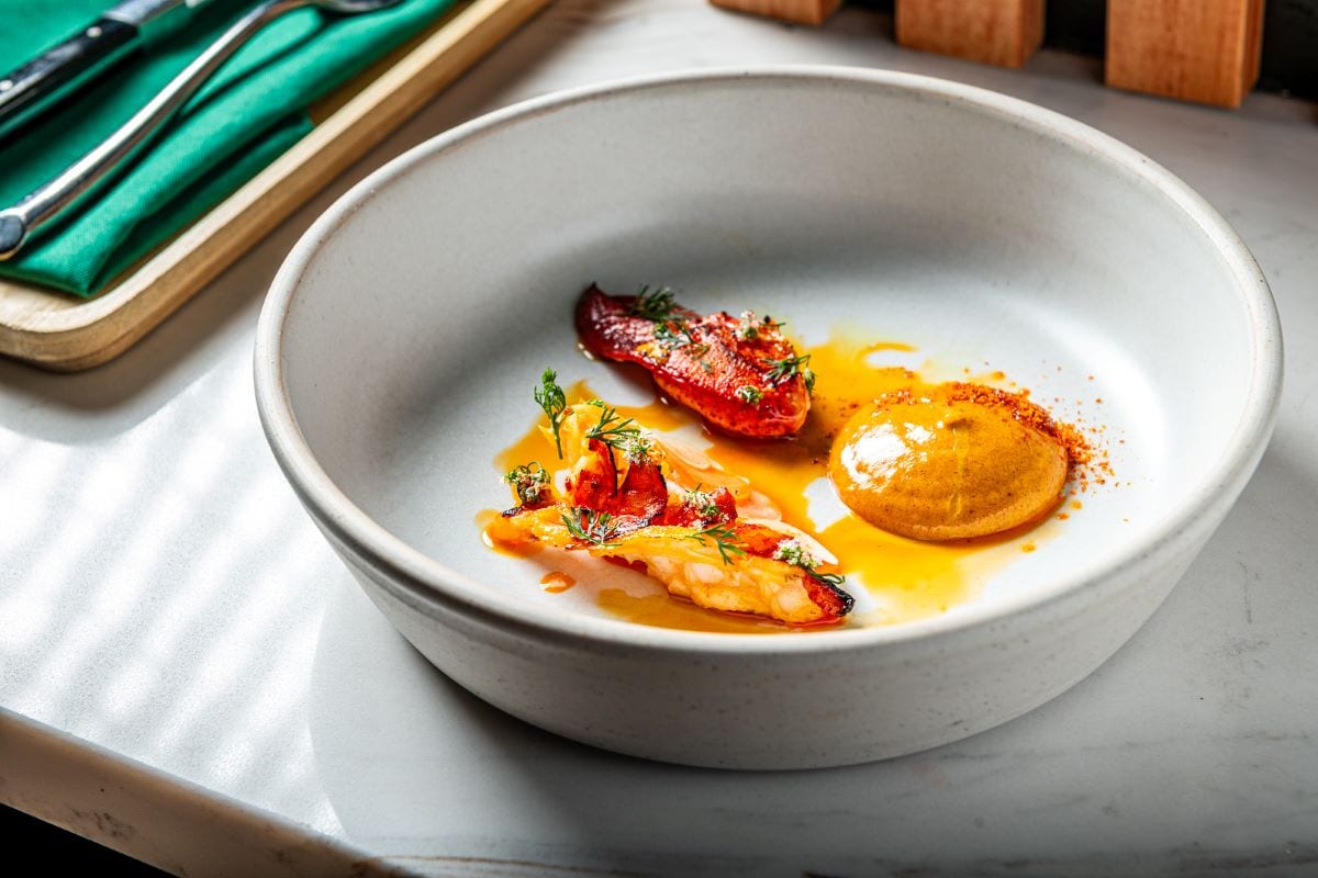 LOBSTER INASAL WITH PAPAYA ATSARA, CHILI-VINEGAR AIOLI.