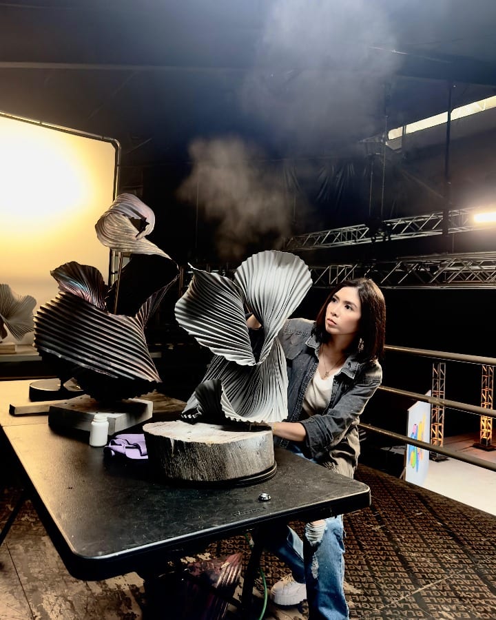 Katrina Cuenca at work on a copper sculpture