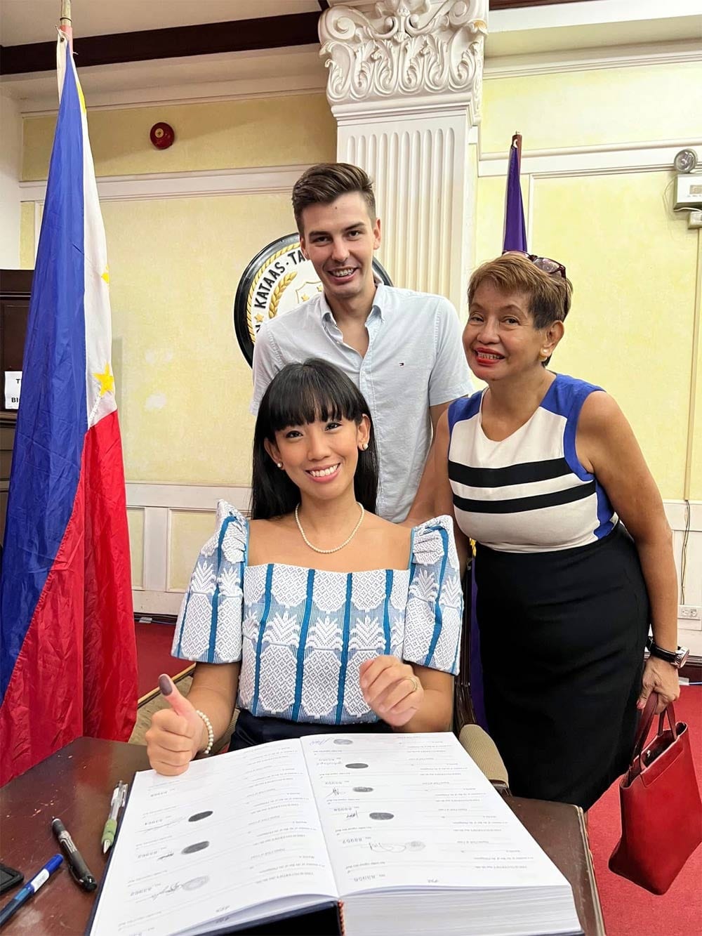 Michal and Julia’s mom, Lilian, witness Julia sign the roll of attorneys at the Supreme Court on June 15, 2022.