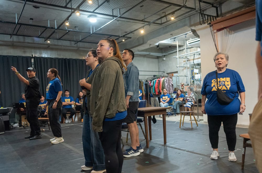 Come From Away rehearsing a scene