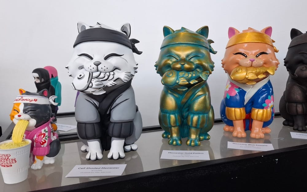 'Cell Shaded Meowster', 'Meowster Gold Patina,' 'Meowster Blue Kimono' and 'Copper Meowster' by Vincent Trinidad
