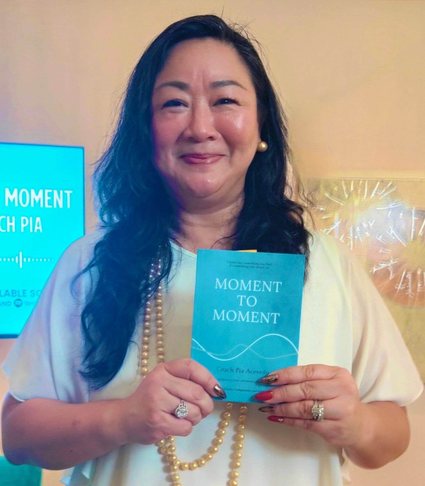 Pia Acevedo with her new book